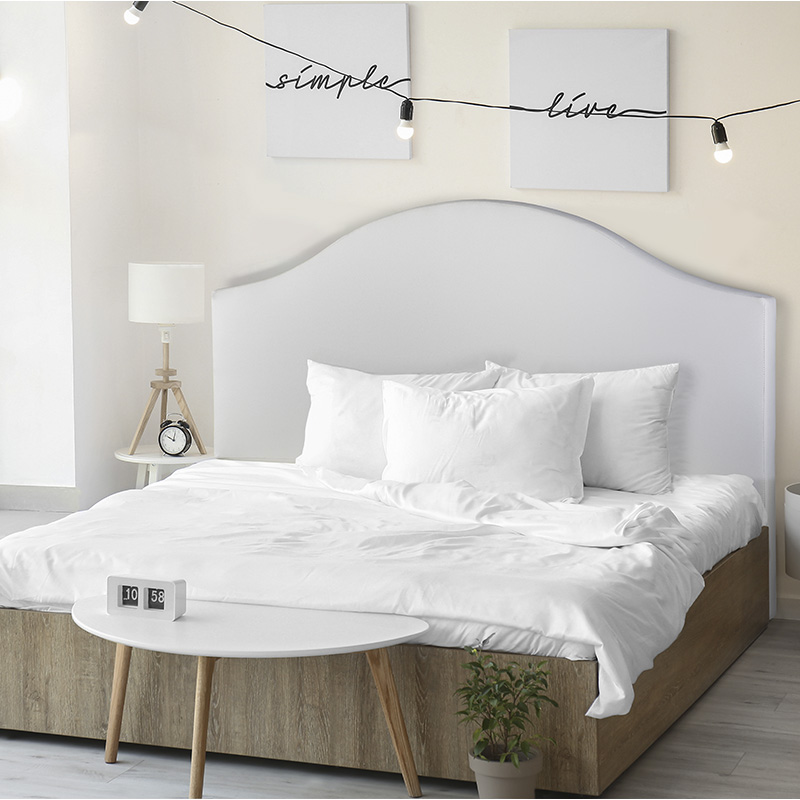 image of luxury bedroom double bed with pillows and image frames